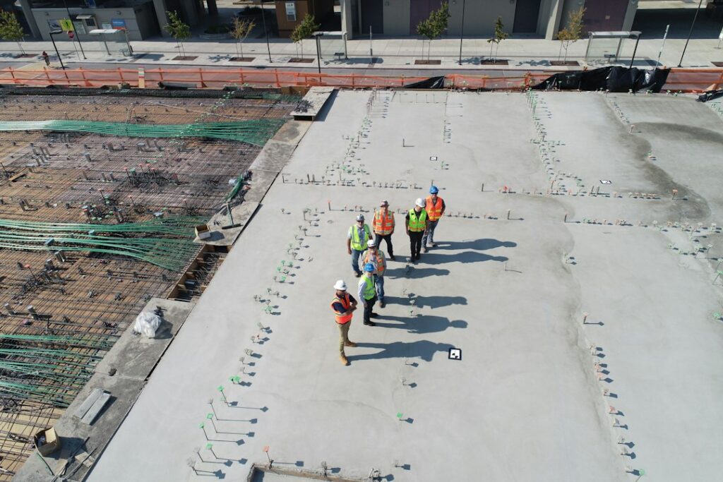 Commercial roofing crew working on a flat roof — photo by Scott Blake on Unsplash